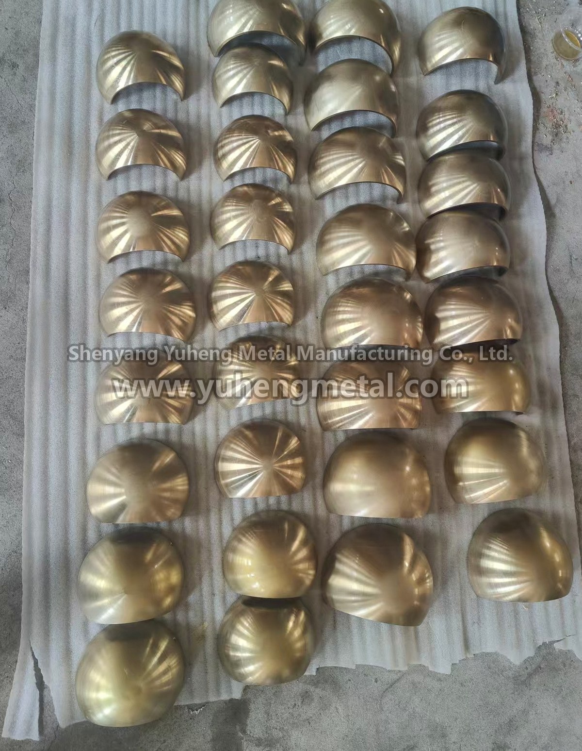 Batch of machined ball and socket liner halves in nickel-aluminium bronze