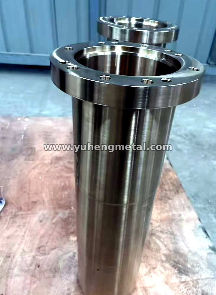 Large flanged bronze bushing with bolt holes and a finish-machined bore