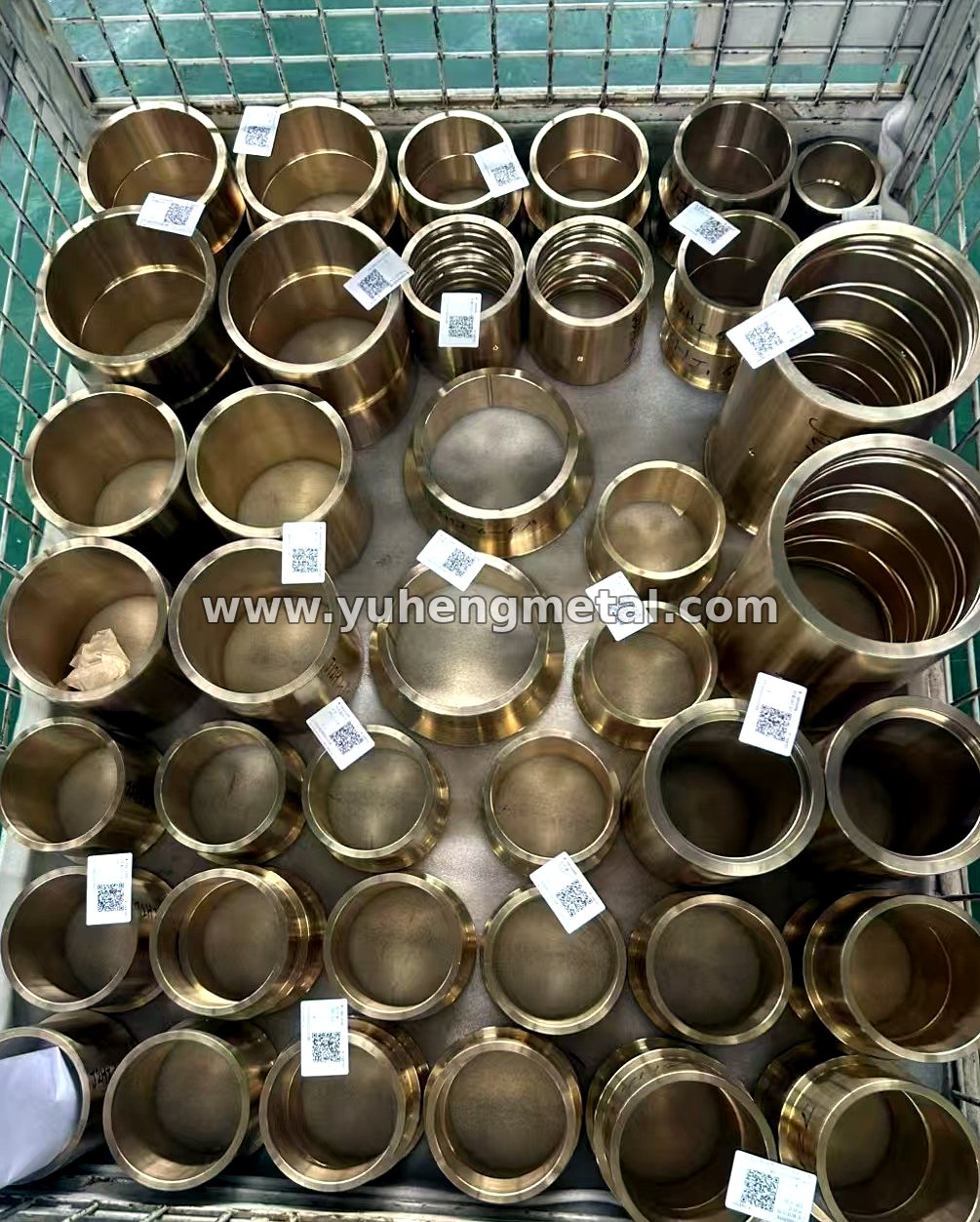 Batch of machined bronze bushings in the workshop, ready for inspection