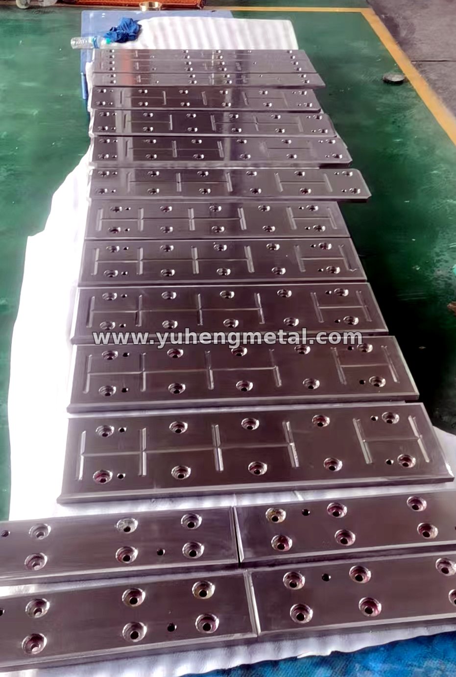 Wear-resistant composite plates laid out in rows for inspection