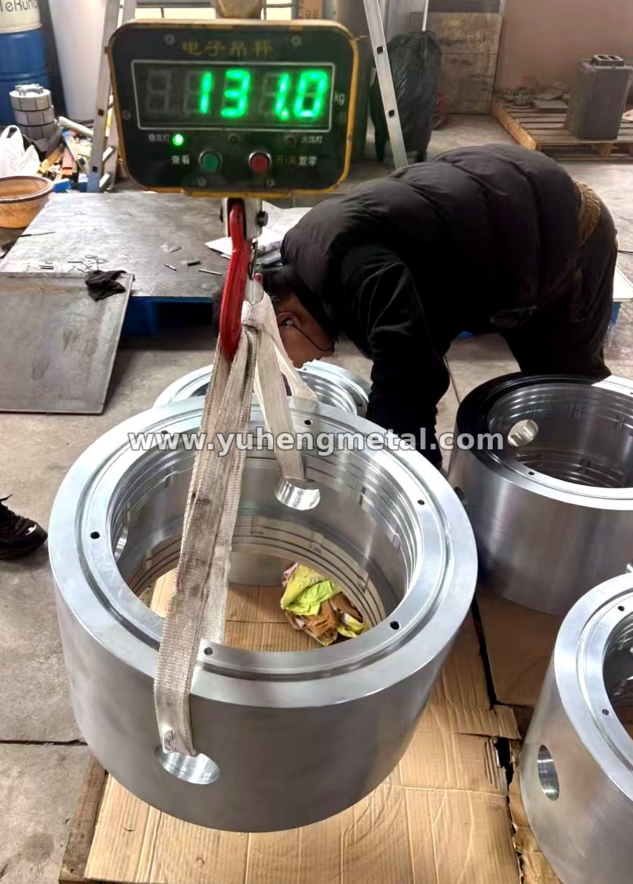 Large zinc-based alloy bearing ring being weighed at 131 kg in the workshop